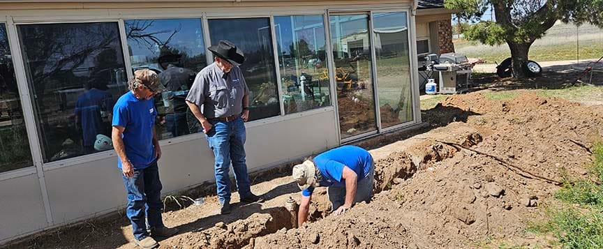 digging sewer ditch at Midland home